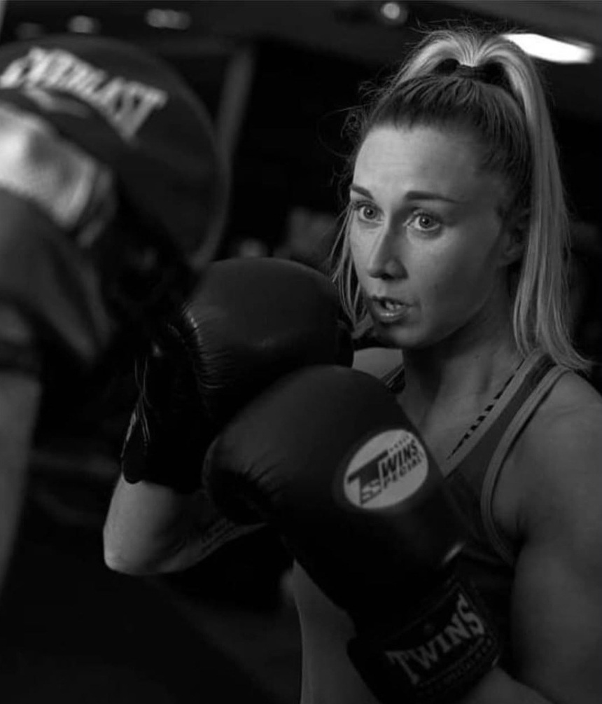 Professional personal trainer coaching client